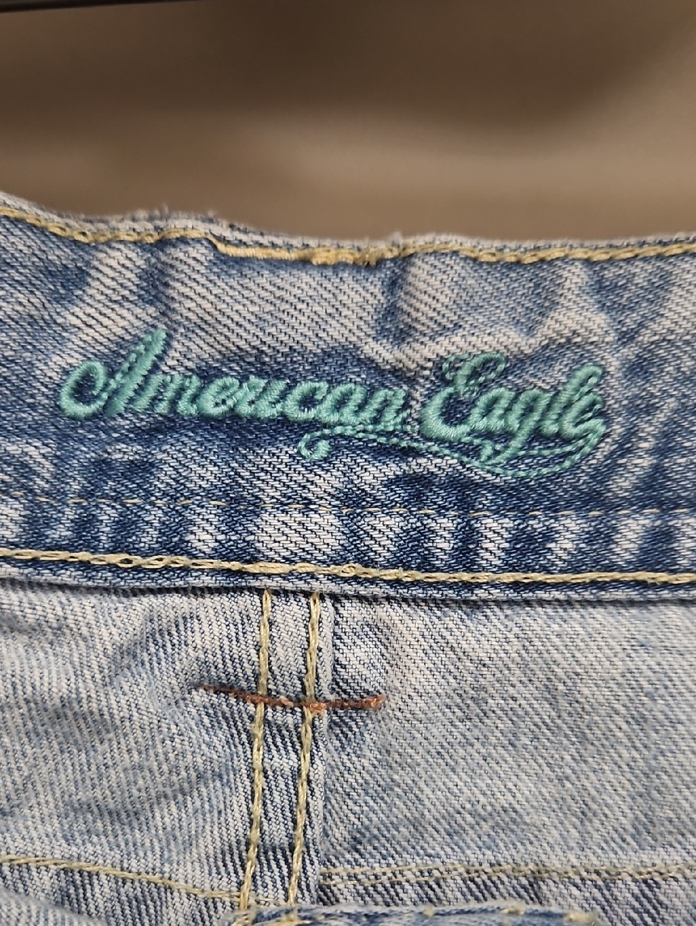 American Eagle | Y2K light denim shorts distressed flap-closure back pockets. 12 - Picture 8 of 13